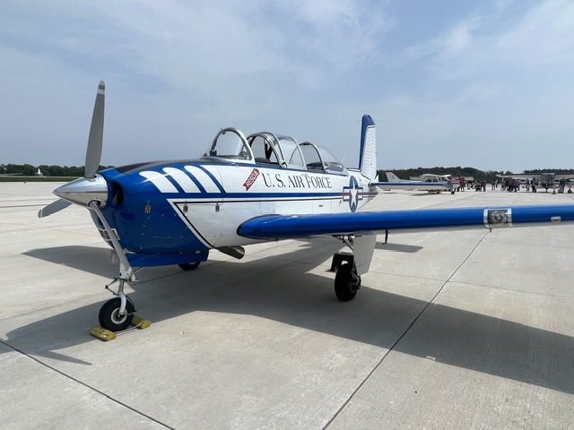 Restored vintage U.S. Air Force training aircraft on the airfield ramp